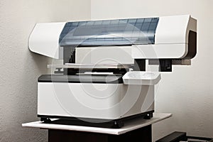 One modern printer in room. Printing equipment