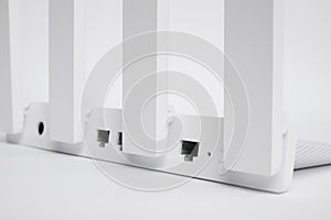 One modern Wi-Fi router on white background, closeup