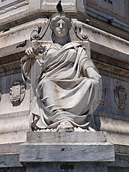 Statue at the column Restauradores in Lisbon Portugal photo