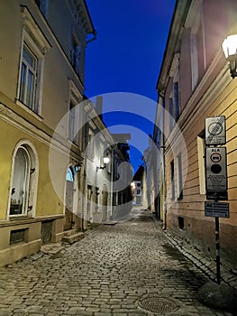 One of the narrow, cobbled streets of Old Tallinn against the blue sky. Spring evening. Wanalynn area