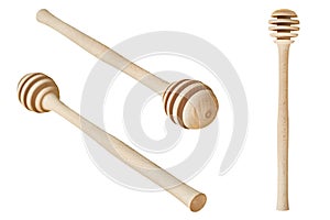One new clean ribbed wooden dipper for tasty and sweet apian honey isolated on white background