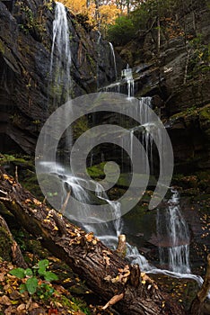 Water cascading over moss covered rock