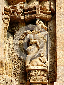One of the numerous idols curved out of stones on a wall of Konark Sun Temple, Odisha, India