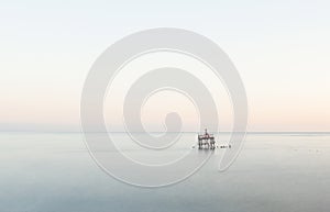 One oceanographer stands on the sea. Sea background landscape