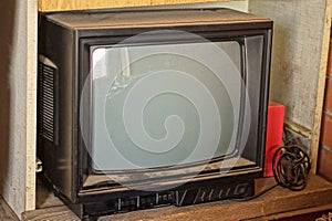 One old black TV with a gray kinescope