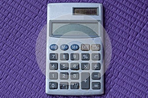 One old gray electronic calculator