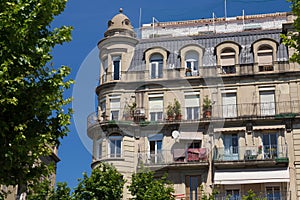 One of the old historical buildings in modern style in the center of Barcelona in sunny day. Spain