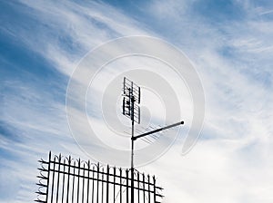 One old terrestrial tv antenna on roof