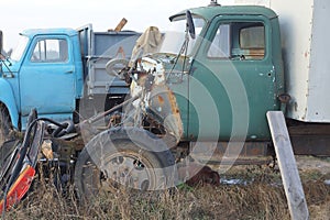 One old truck with a dismantled green cab