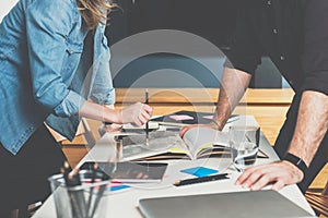 One-on-one meeting. Business meeting. Teamwork. Businessman and businesswoman standing near table in front of each other