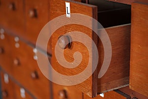 One of the open wooden locker drawers