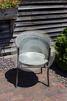 One outdoor steel chair at the Amana Colonies