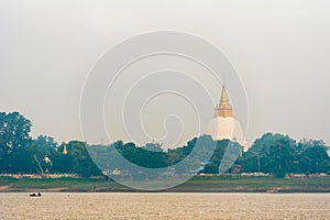 One pagoda on the banks of the Irrawaddy river, Mandalay, Myanmar, Burma. Copy space for text.