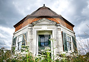 Windsor, United Kingdom - 28 July 2020: One of the Pair of Lutyens Kiosks on the Runnymede meadow, wide angle front view of