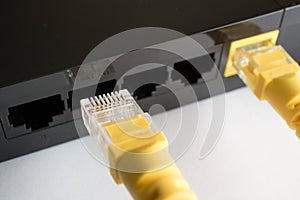 One patch cord is inserted into the yellow connector of the router