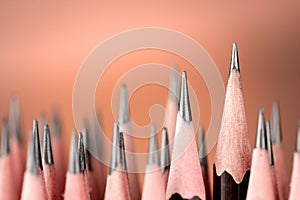 One pencil standing out from the group