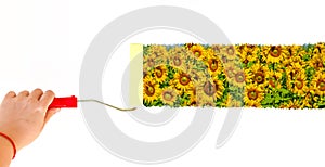One person painting a landscape with sunflowers on a white wall with a roller brush