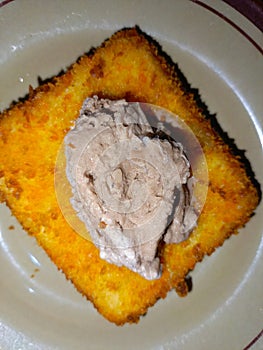 One piece of fried ice cream with chocolate ice cream topping on top adds a sweet taste