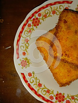 One piece of fried ice cream with chocolate ice cream topping on top adds a sweet taste