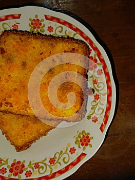 One piece of fried ice cream with chocolate ice cream topping on top adds a sweet taste