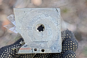 one piece of old gray broken plastic audio cassette