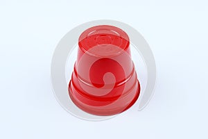One piece red plastic cup on a white isolated background