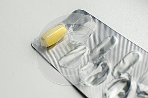 One pill in used blister pack closeup