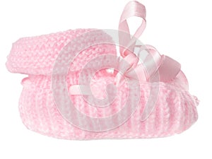 One pink baby bootee with a bow