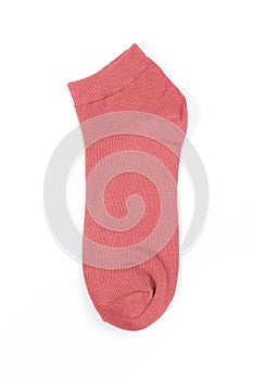 One pink short sock on a white background, top view