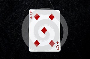 One playing card the five the diamonds