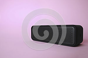 One portable bluetooth speaker on pink background, space for text. Audio equipment
