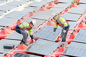 One professional technician worker hold solar cell panel and discuss with co-worker during install or set up or maintenance in