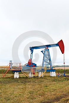 One pump jacks on a oil field.