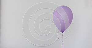 One purple balloon white wall background