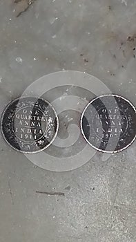 One quqrter annasOld coins