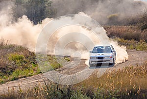 One Rally Car and a lot of Dust on a Sharp Turn