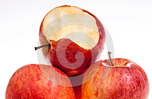 One red apple biten off