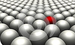 One red ball in amongst many white balls