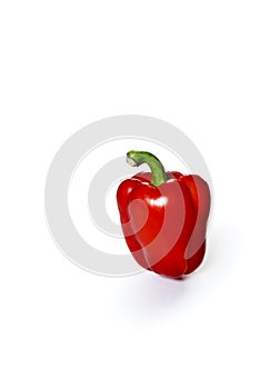 One red bell pepper isolated on a white background