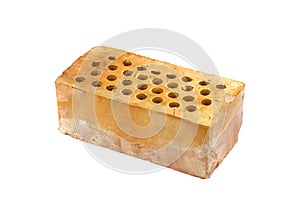 One red clay brick with holes isolated