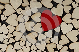 One red heart on the Wooden hearts background