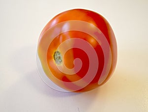 One red tomatoe