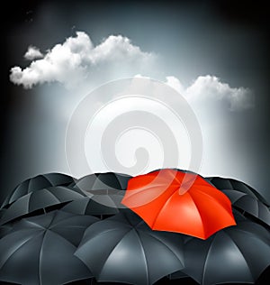 One red umbrella in a group of grey umbrellas.