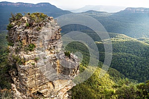 One rock formation of the Three Sisters with view to the valley from Spooners lookout, New South Wales, Australia