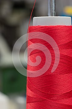 One roll of sewing thread spool macro close up shot