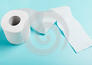 One roll of white toilet paper on a blue background