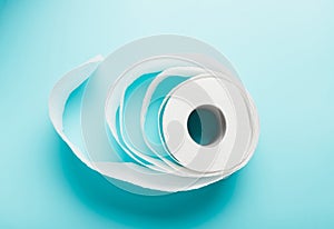 One roll of white toilet paper on a blue background