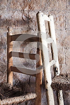 In one room there are two old wooden chairs.