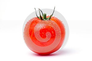 One round red ripe tomato on white isolate background