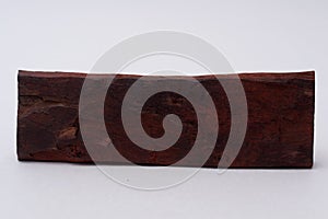 One sandalwood log on white background